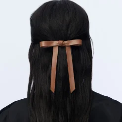 COGNAC BARDOT FAUX LEATHER BOW BARRETTE