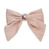LIGHT ROSE NATALIA SWAROVSKI® BOW BARRETTE